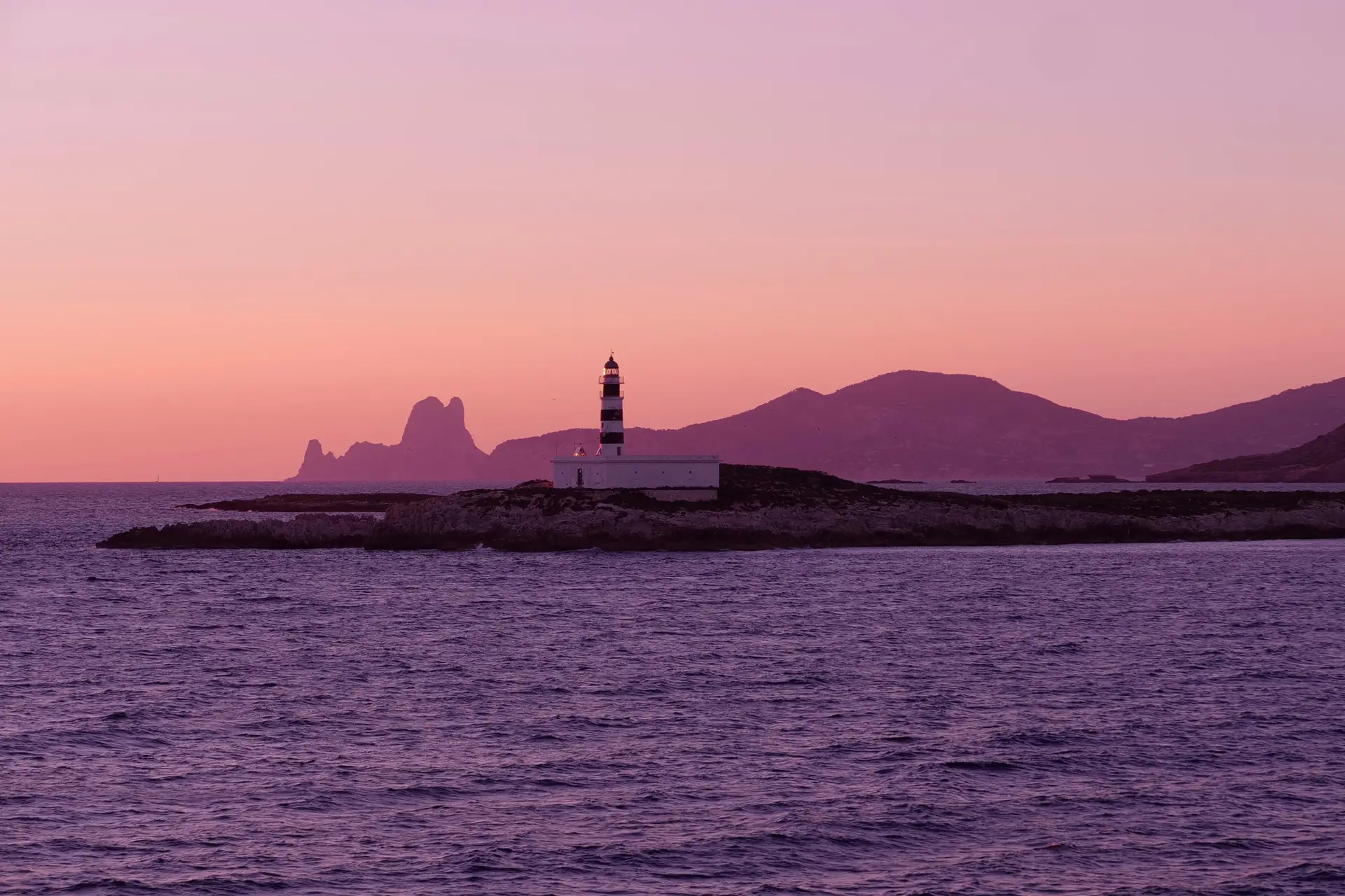 View of Es Vedrà and Far de l'illa des Penjats in Formentera